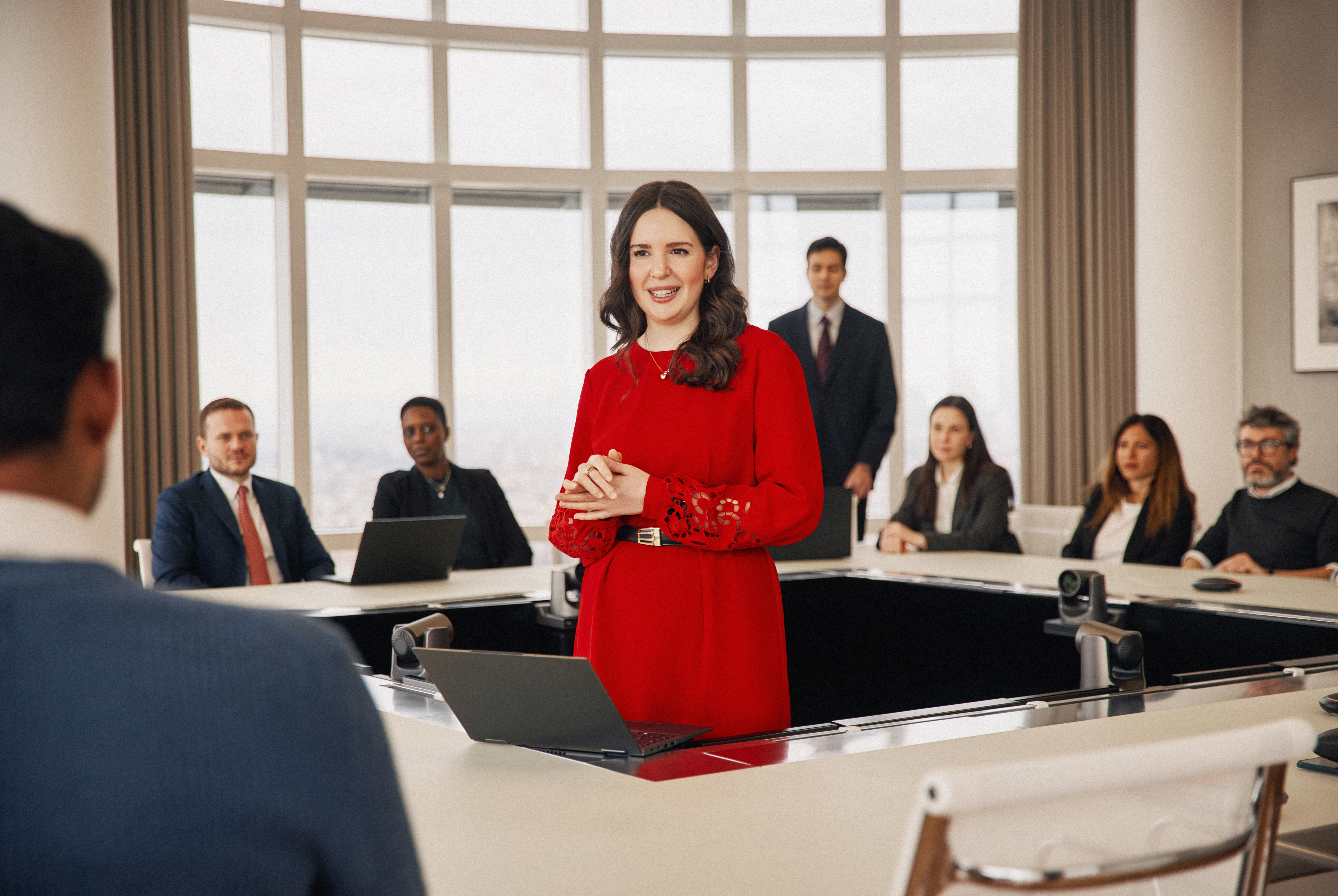 Team of young and middle-aged diverse businesspeople take part in group meeting